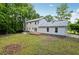Spacious backyard with lush greenery and ample space for outdoor activities at 56 Carlane Cir, Bowdon, GA 30108