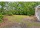 Large backyard with mature trees offers privacy and a peaceful setting at 56 Carlane Cir, Bowdon, GA 30108