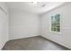 Cozy bedroom with gray carpet, neutral walls, a closet, and a bright window at 56 Carlane Cir, Bowdon, GA 30108