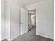 Bright hallway with neutral walls leads to bedrooms and bathrooms at 56 Carlane Cir, Bowdon, GA 30108