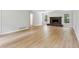 Bright and open living room with a brick fireplace, newly refinished floors, and a comfortable layout at 56 Carlane Cir, Bowdon, GA 30108