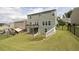 Backyard featuring a wooden deck, walk-out basement, fenced-in yard, and a sloping lawn at 1530 Avalon Creek Rd, Sugar Hill, GA 30518
