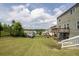 Well-maintained backyard featuring a wooden deck, walk-out basement and a fenced-in yard at 1530 Avalon Creek Rd, Sugar Hill, GA 30518