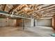 Unfinished basement with concrete floor and exposed insulation at 1530 Avalon Creek Rd, Sugar Hill, GA 30518