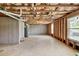 Unfinished basement with concrete floor, hot water tank and window at 1530 Avalon Creek Rd, Sugar Hill, GA 30518