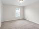 Bedroom featuring neutral carpet and window at 1530 Avalon Creek Rd, Sugar Hill, GA 30518