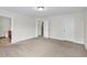 Bedroom showcasing neutral carpet and en suite bathroom at 1530 Avalon Creek Rd, Sugar Hill, GA 30518