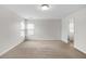 Large bedroom with neutral carpet, window, and natural light at 1530 Avalon Creek Rd, Sugar Hill, GA 30518