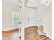 Welcoming foyer with hardwood flooring and a staircase leading to the upper level at 1530 Avalon Creek Rd, Sugar Hill, GA 30518