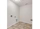 Laundry room featuring tile floors and utility connections at 1530 Avalon Creek Rd, Sugar Hill, GA 30518