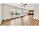 Open floor plan features hardwood floors, lots of windows and adjoins the kitchen at 1530 Avalon Creek Rd, Sugar Hill, GA 30518