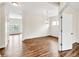 Living room with abundant natural light, neutral walls, and hardwood-style floors, creating a cozy atmosphere at 1530 Avalon Creek Rd, Sugar Hill, GA 30518