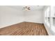 Bright living room with hardwood floors, lots of light, ceiling fan, ready to move in at 1530 Avalon Creek Rd, Sugar Hill, GA 30518