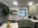 Contemporary kitchen with stainless appliances, green cabinetry, and ample counter space at 2225 Baker Nw Ter, Atlanta, GA 30318