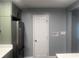 Bright kitchen with stainless steel refrigerator, new countertop, and a conveniently placed door at 2225 Baker Nw Ter, Atlanta, GA 30318