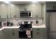 Well-lit kitchen with stainless steel appliances, modern cabinetry, and sleek countertops at 2225 Baker Nw Ter, Atlanta, GA 30318