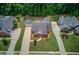 An aerial view showcases a home's manicured lawn and professional landscaping at 3468 Aberrone Pl, Buford, GA 30519
