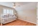 Light filled bedroom with plantation shutters and beautiful hardwood floors at 3468 Aberrone Pl, Buford, GA 30519