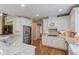 Spacious kitchen with granite countertops, stainless steel appliances, and hardwood flooring at 3468 Aberrone Pl, Buford, GA 30519
