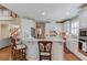 Bright and airy kitchen with white cabinets, granite countertops, and stainless steel appliances at 3468 Aberrone Pl, Buford, GA 30519