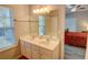 Bathroom with a double sink vanity and a tub and shower at 4149 Spring Cove Dr, Duluth, GA 30097