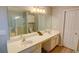 Bathroom featuring dual sinks, a large mirror, and a spacious vanity area at 4149 Spring Cove Dr, Duluth, GA 30097