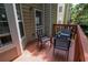 Inviting deck area features outdoor furniture, offering a private space for relaxation and enjoying the outdoors at 4149 Spring Cove Dr, Duluth, GA 30097