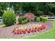 Sign at the entrance of Chattahoochee Cove, surrounded by lush landscaping and flowers at 4149 Spring Cove Dr, Duluth, GA 30097