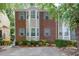 Attractive brick townhouse with well-maintained landscaping, providing a welcoming and comfortable living environment at 4149 Spring Cove Dr, Duluth, GA 30097