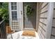 Charming front entrance with a welcoming mat and a decorative wreath, enhancing curb appeal at 4149 Spring Cove Dr, Duluth, GA 30097