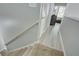 Hallway with wooden floors and neutral tones, leading to a well-lit room at 4149 Spring Cove Dr, Duluth, GA 30097