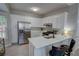 Bright eat-in kitchen with stainless steel appliances and white cabinets at 4149 Spring Cove Dr, Duluth, GA 30097