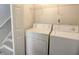 Laundry room with washer and dryer and shelving for storage at 4149 Spring Cove Dr, Duluth, GA 30097