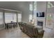 Large living room featuring high ceilings, a fireplace, and ample natural light, creating a welcoming atmosphere at 4149 Spring Cove Dr, Duluth, GA 30097