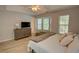 Serene main bedroom with hardwood floors, ample natural light, and comfortable furnishings at 4149 Spring Cove Dr, Duluth, GA 30097