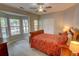 Bedroom with many windows, a ceiling fan, and a sleigh bed at 4149 Spring Cove Dr, Duluth, GA 30097