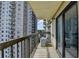 This balcony features a metal railing, and an AC unit, with a view of a neighboring apartment building at 795 Hammond Dr # 1108, Atlanta, GA 30328