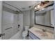 The bathroom features a tub and shower combination, a toilet, and a vanity sink with a mirror at 795 Hammond Dr # 1108, Atlanta, GA 30328