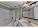 The bathroom features a tub and shower combination, a toilet, and a vanity sink with a mirror at 795 Hammond Dr # 1108, Atlanta, GA 30328