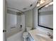 The bathroom features a tub and shower combination, a toilet, and a vanity sink with a mirror at 795 Hammond Dr # 1108, Atlanta, GA 30328