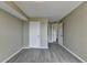 This bedroom features gray floors, neutral walls, and a view into a hallway with multiple doors at 795 Hammond Dr # 1108, Atlanta, GA 30328