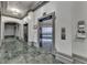 Condominium elevator with marble floors and detailed molding at 795 Hammond Dr # 1108, Atlanta, GA 30328