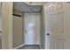 Condominium front door with coat hooks and access to secondary room at 795 Hammond Dr # 1108, Atlanta, GA 30328