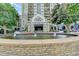 The Park Towers entrance complete with water feature and lush landscaping at 795 Hammond Dr # 1108, Atlanta, GA 30328