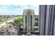 High-rise condo building with a beautiful facade, lush landscaping and other high rise buildings in the background at 795 Hammond Dr # 1108, Atlanta, GA 30328