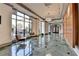 Hallway with marble floors, wood walls and lounge chairs at 795 Hammond Dr # 1108, Atlanta, GA 30328