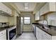 Modern kitchen featuring stainless steel appliances, granite countertops and white cabinets at 795 Hammond Dr # 1108, Atlanta, GA 30328