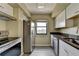 Modern kitchen featuring stainless steel appliances, granite countertops and white cabinets at 795 Hammond Dr # 1108, Atlanta, GA 30328