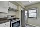 Modern kitchen featuring stainless steel appliances, granite countertops and white cabinets at 795 Hammond Dr # 1108, Atlanta, GA 30328