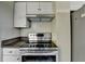 Modern kitchen featuring stainless steel appliances and granite countertops at 795 Hammond Dr # 1108, Atlanta, GA 30328